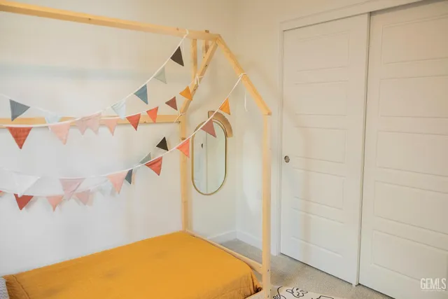 a bathroom with a sink a toilet and shower curtain