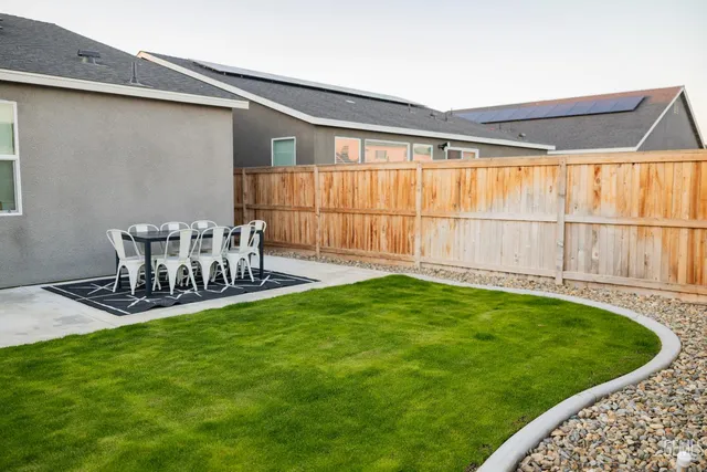 a patio with table and chairs