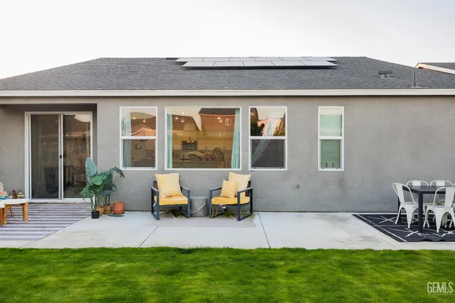 a patio with table and chairs