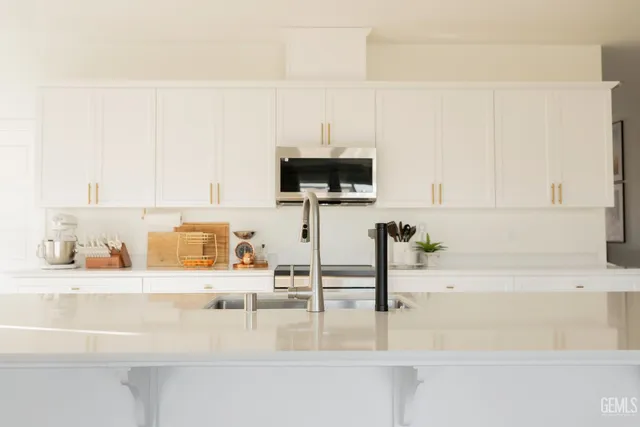 a kitchen with a sink and a cabinets