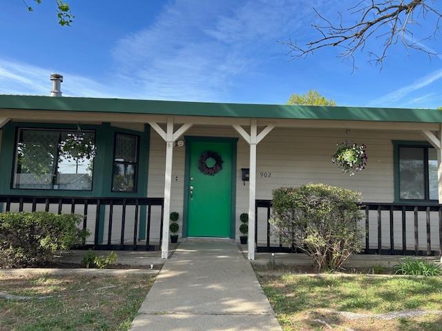 entrance to property with covered porch