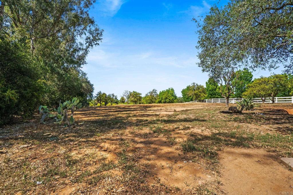 13511 Hilldale Road Valley Center, CA 92082 - Photo 19 of 46 a view of dirt field with trees in the background