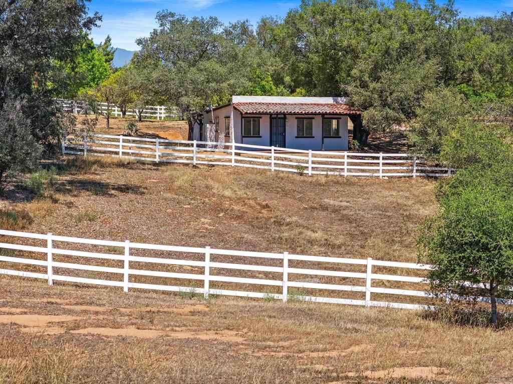 13511 Hilldale Road Valley Center, CA 92082 - Photo 26 of 46 a view of a house with a backyard