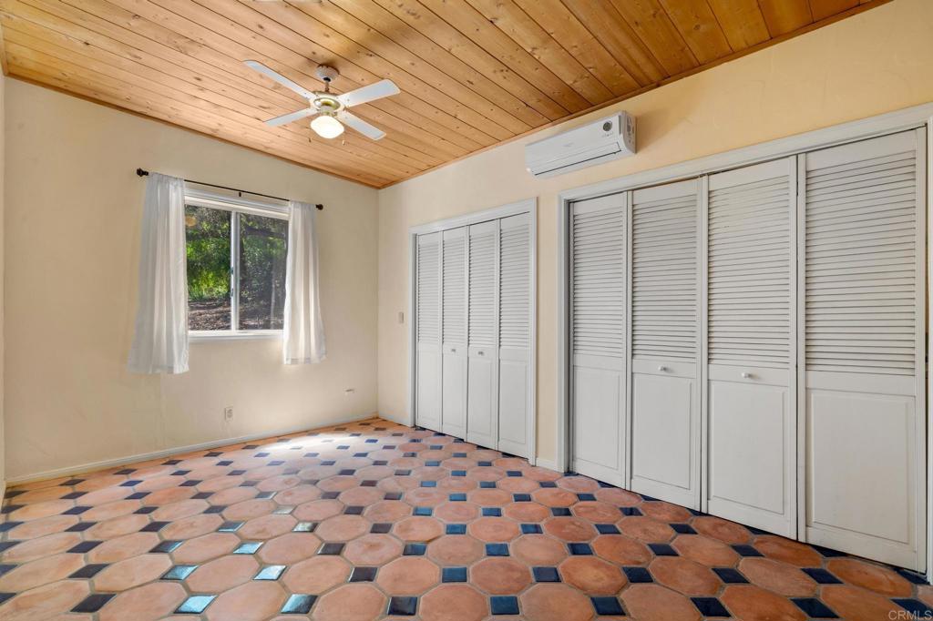 13511 Hilldale Road Valley Center, CA 92082 - Photo 40 of 46 a bedroom with bed and a window