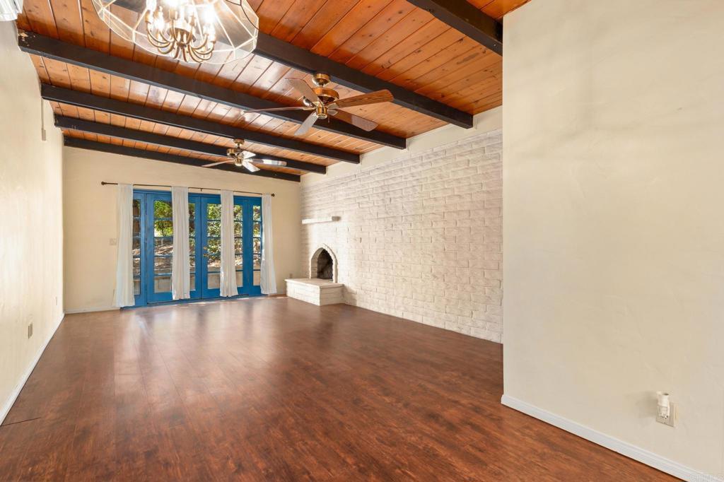 13511 Hilldale Road Valley Center, CA 92082 - Photo 42 of 46 an empty room with wooden floor and plants