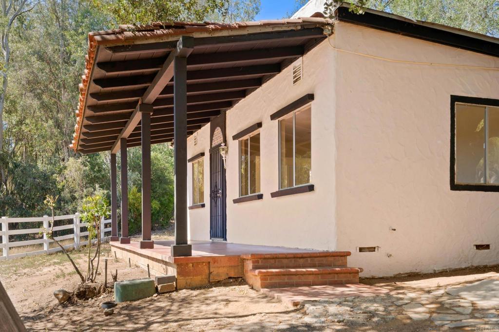 13511 Hilldale Road Valley Center, CA 92082 - Photo 45 of 46 a backyard of a house with barbeque oven table and chairs