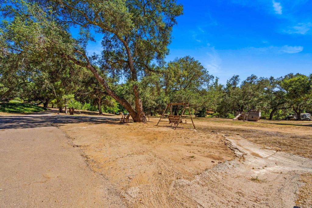 13511 Hilldale Road Valley Center, CA 92082 - Photo 10 of 46 a view of swimming pool with trees