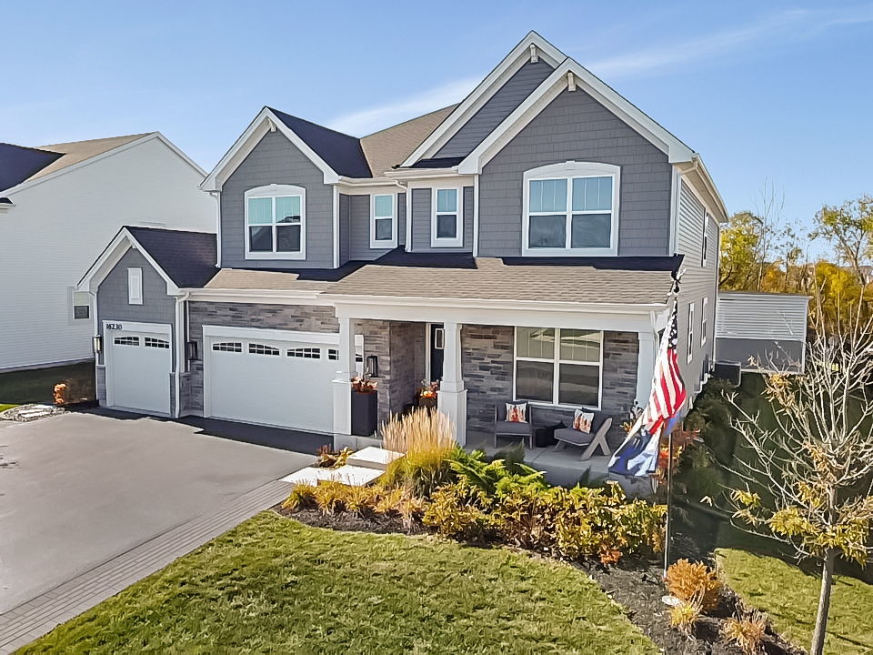 16230 Lake View Road Plainfield, IL 60586 - Photo 1 of 62 a view of a house with a yard and plants