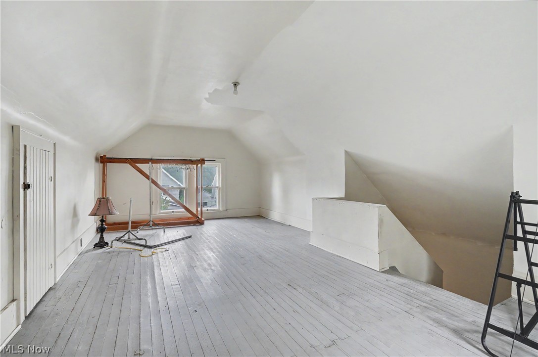 456 Delmar Avenue Akron, OH 44310 - Photo 24 of 27 Spacious attic room with painted wood plank flooring