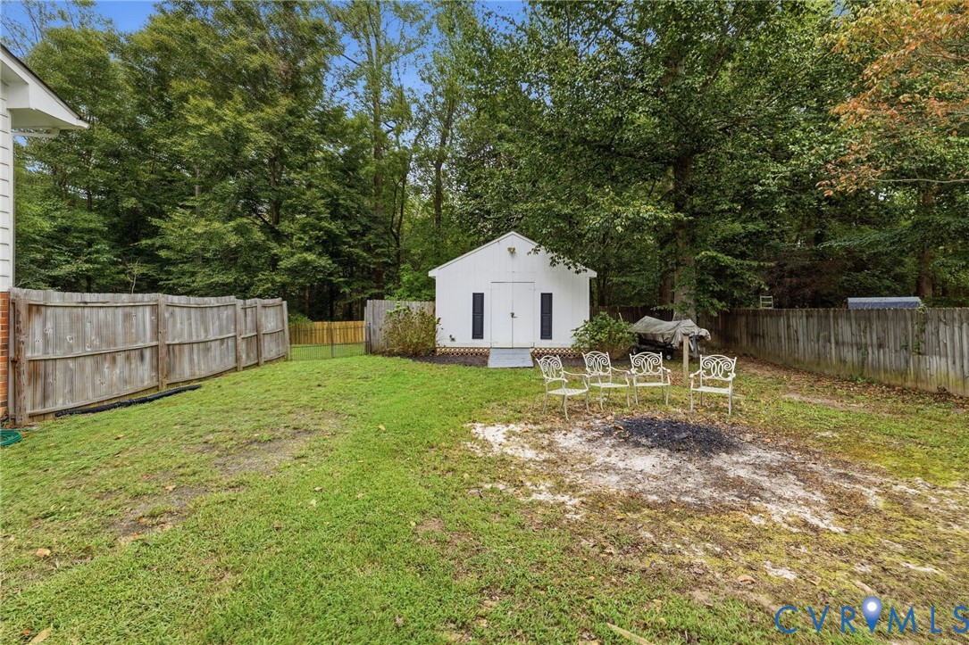 6723 Cherry Road Quinton, VA 23141 - Photo 26 of 28 Expansive backyard with a dedicated storage shed,
