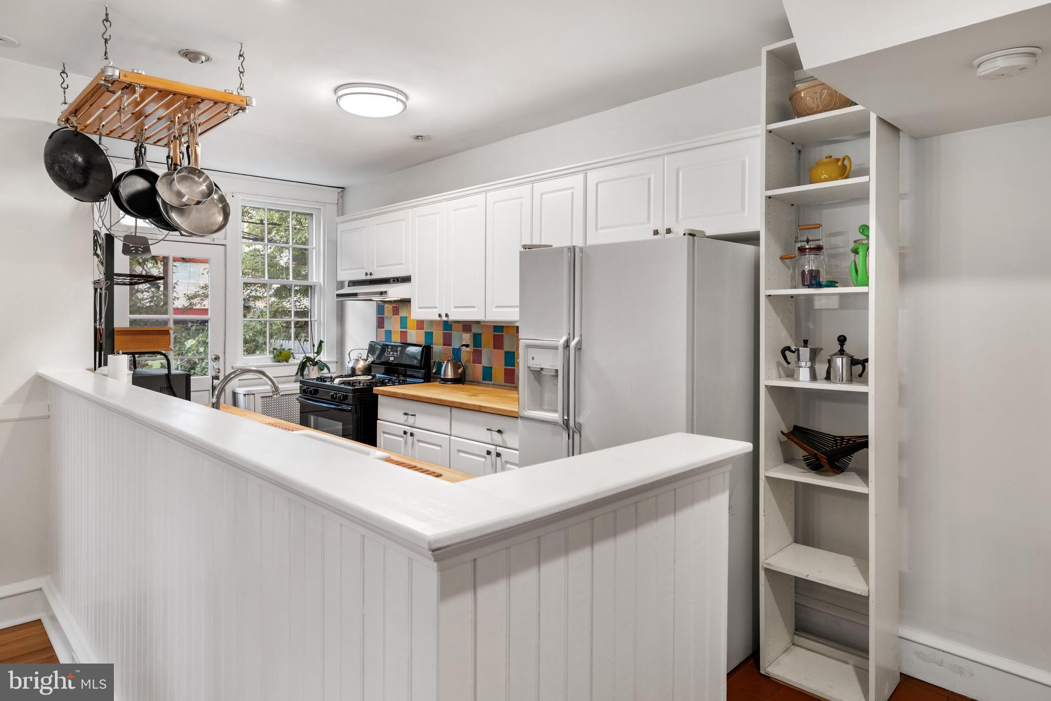 315 Wellesley Road Philadelphia, PA 19119 - Photo 11 of 32 a kitchen with stainless steel appliances a refrigerator and cabinets