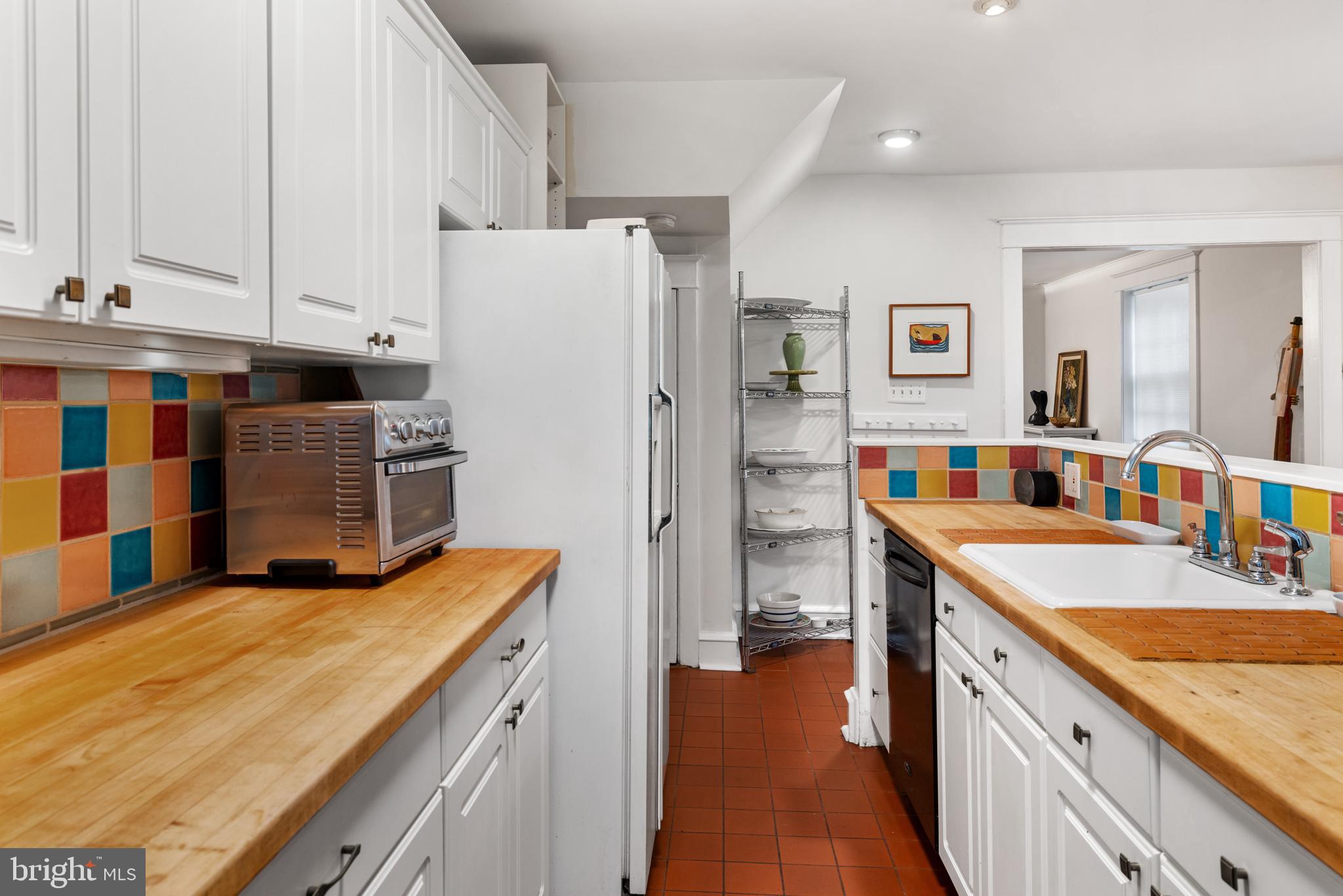 315 Wellesley Road Philadelphia, PA 19119 - Photo 12 of 32 a kitchen with a sink stove and refrigerator