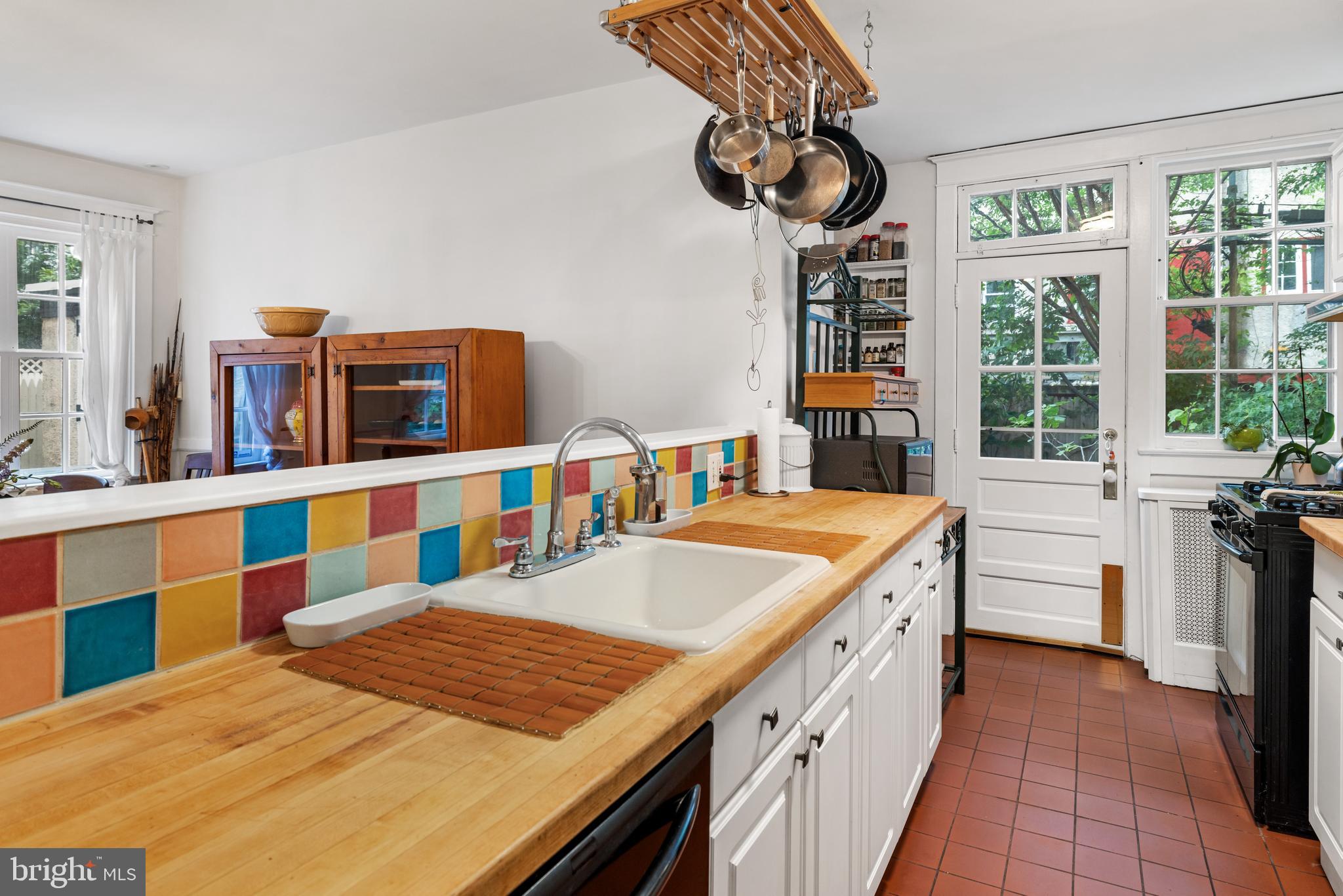 315 Wellesley Road Philadelphia, PA 19119 - Photo 13 of 32 a kitchen with stainless steel appliances kitchen island granite countertop a sink and cabinets