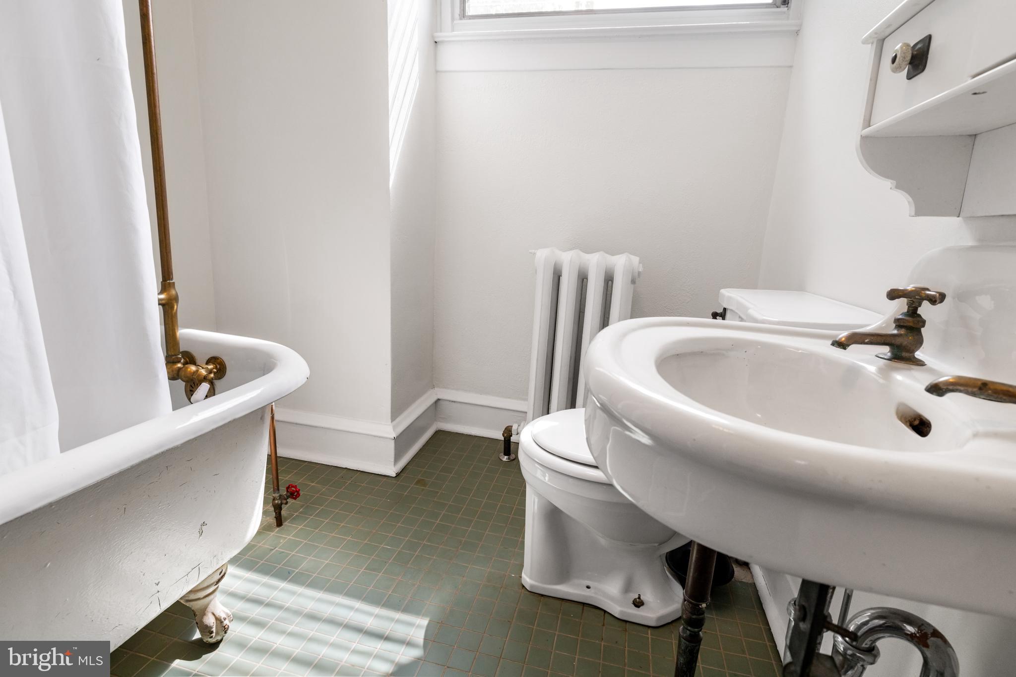 315 Wellesley Road Philadelphia, PA 19119 - Photo 27 of 32 a bathroom with a sink and mirror