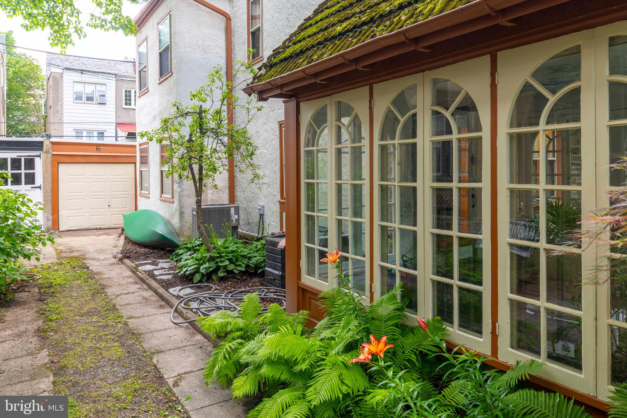 315 Wellesley Road Philadelphia, PA 19119 - Photo 4 of 32 a view of a backyard with potted plants