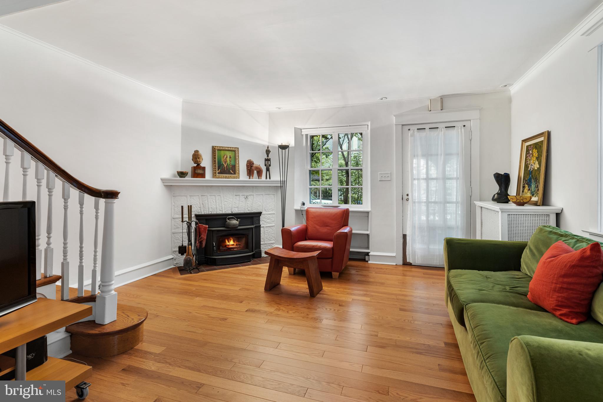 315 Wellesley Road Philadelphia, PA 19119 - Photo 8 of 32 a living room with furniture and a fireplace