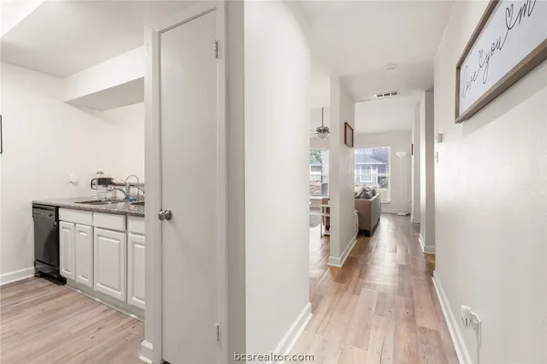 a kitchen with stainless steel appliances granite countertop a stove and a microwave