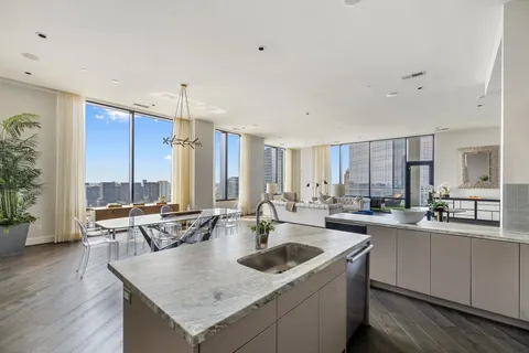 a kitchen with stainless steel appliances a sink stove and refrigerator