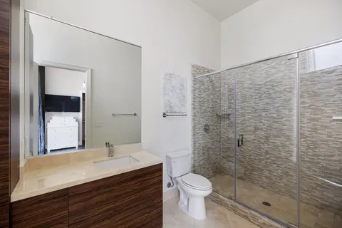 a view of a room with wooden floor and large windows