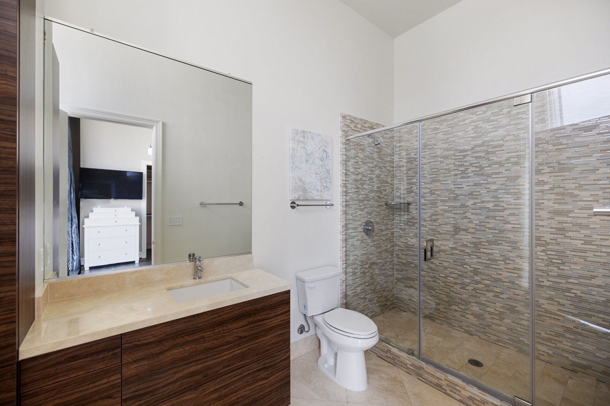 1409 Post Oak Boulevard, Unit 2702 Houston, TX 77056 - Photo 24 of 43 a bathroom with a sink a toilet and shower