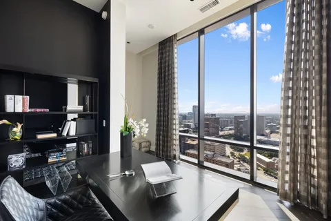 a living room with furniture and a rug