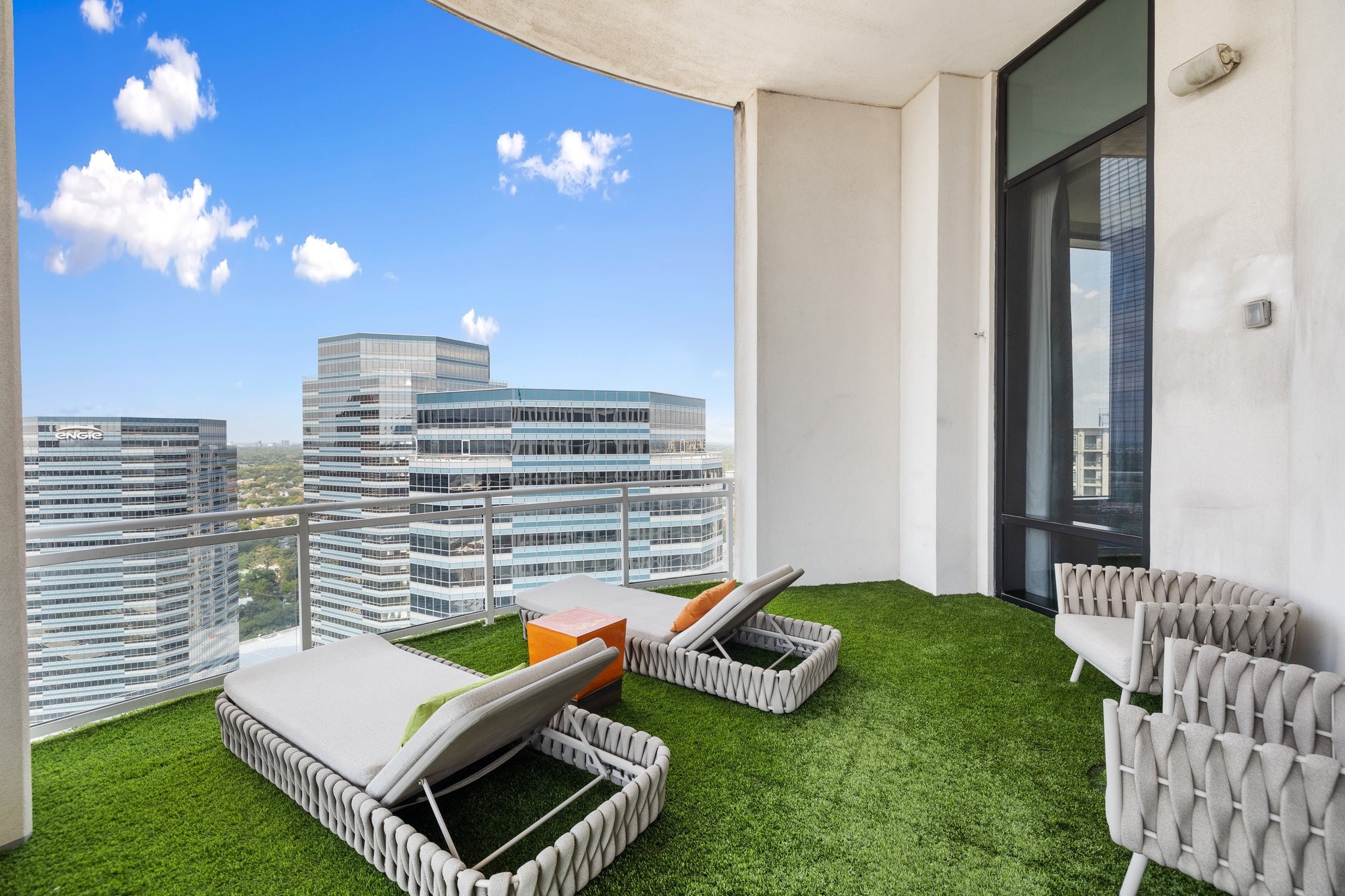 1409 Post Oak Boulevard, Unit 2702 Houston, TX 77056 - Photo 32 of 43 a view of a bedroom with a bed and table