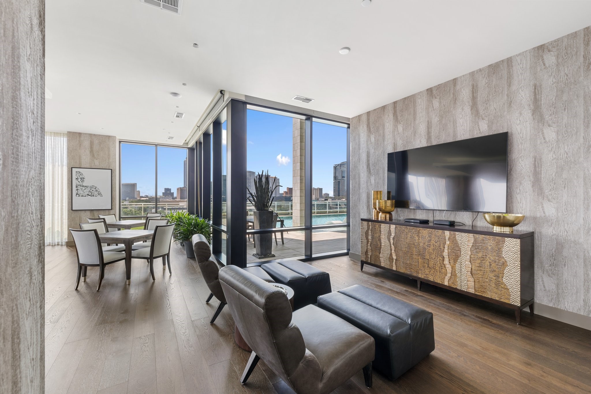 1409 Post Oak Boulevard, Unit 2702 Houston, TX 77056 - Photo 41 of 43 a living room with furniture and a flat screen tv
