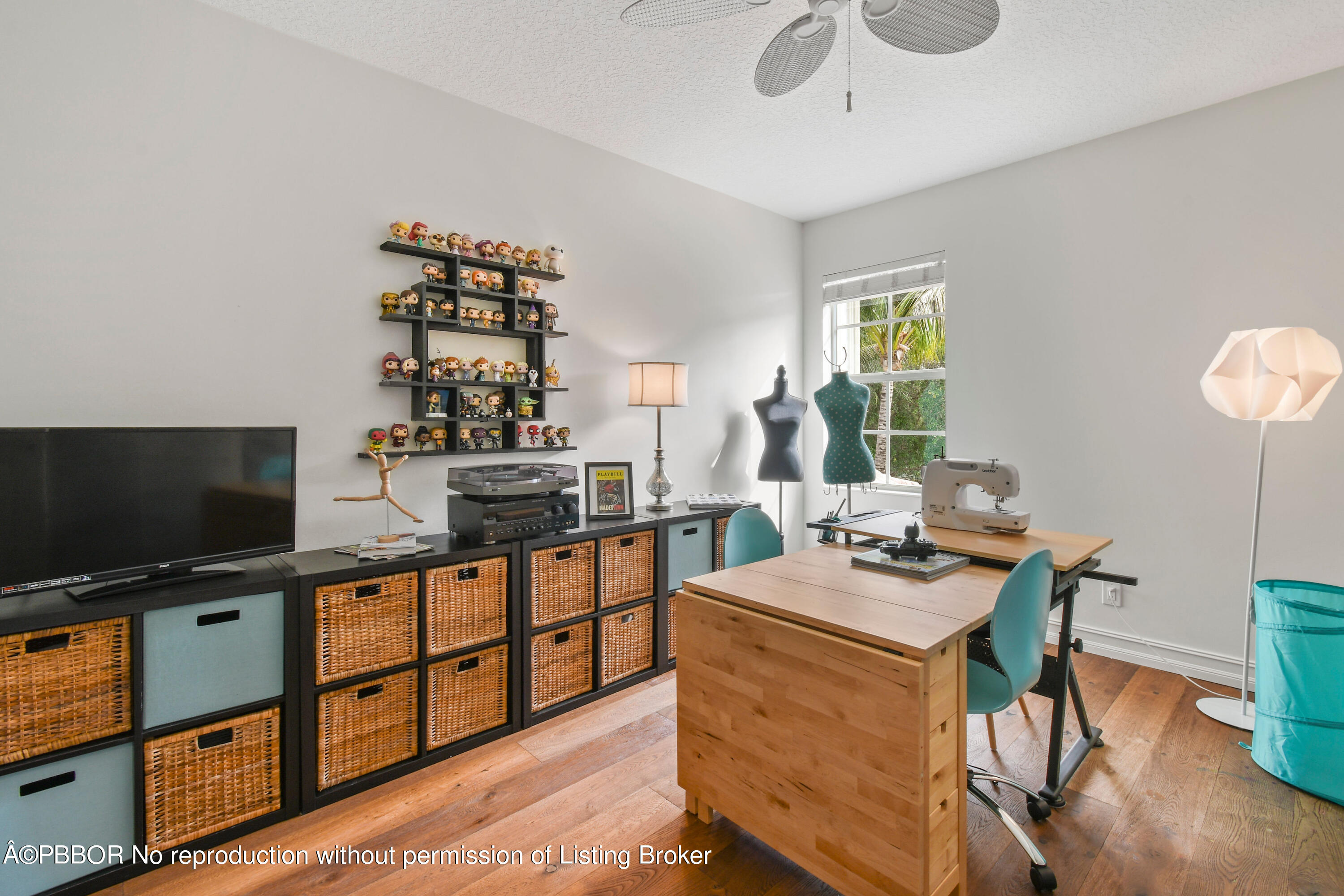 139 Florence Drive Jupiter, FL 33458 - Photo 20 of 33 a work room with furniture a flat screen tv and a window
