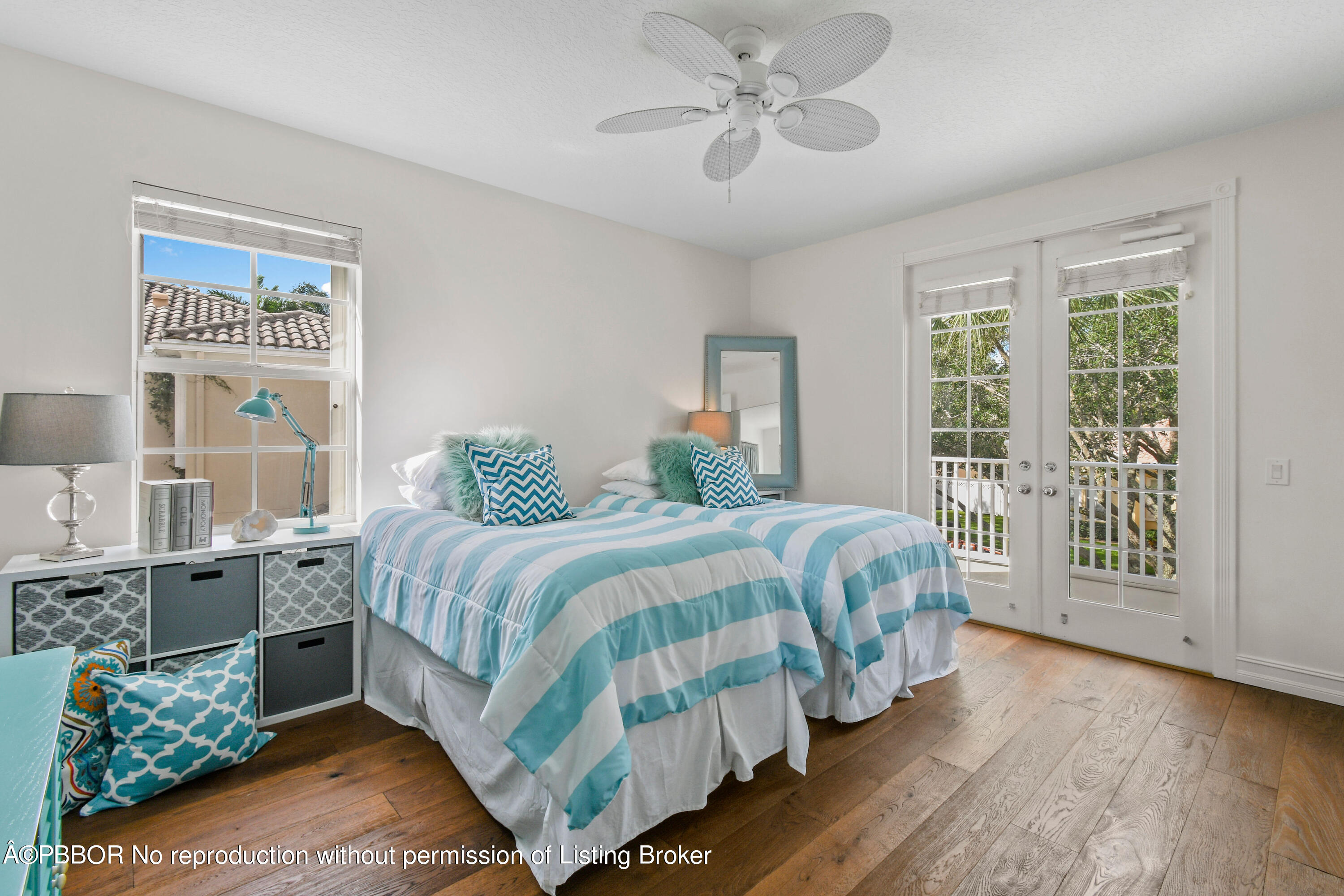 139 Florence Drive Jupiter, FL 33458 - Photo 23 of 33 a bedroom with a bed chandelier and a window