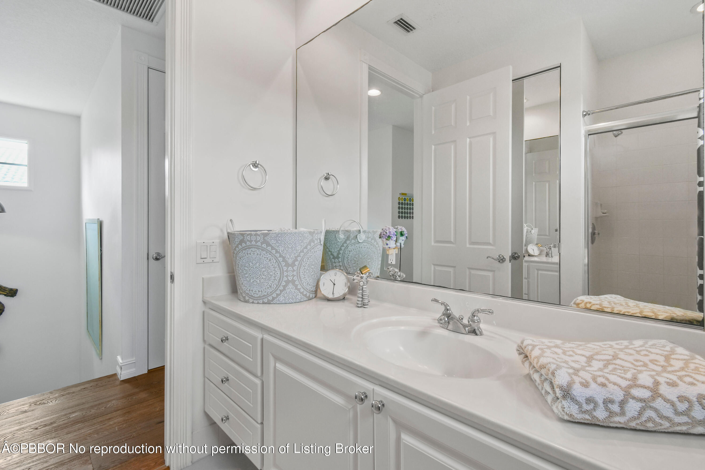139 Florence Drive Jupiter, FL 33458 - Photo 25 of 33 a bathroom with a granite countertop sink and a mirror