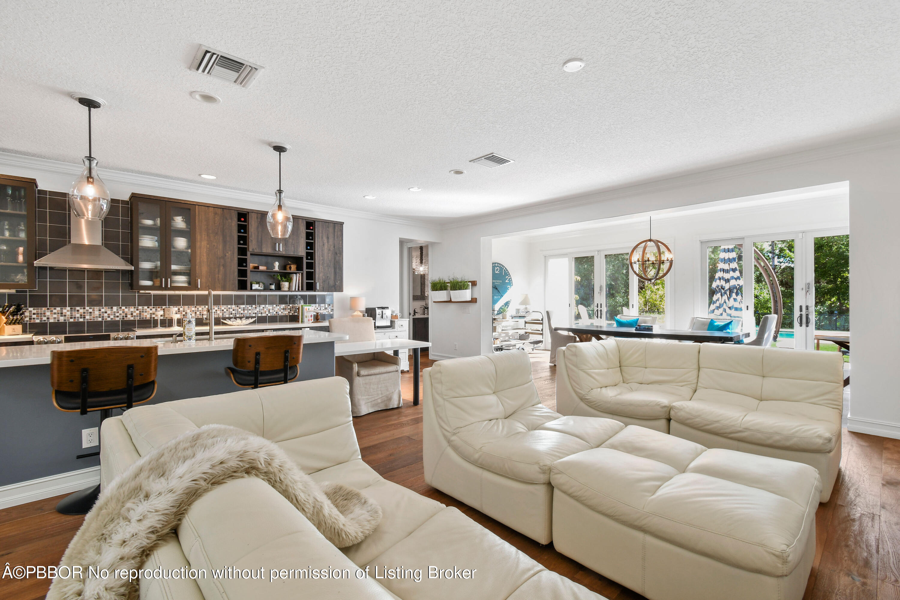 139 Florence Drive Jupiter, FL 33458 - Photo 8 of 33 a living room with furniture kitchen view and a wooden floor
