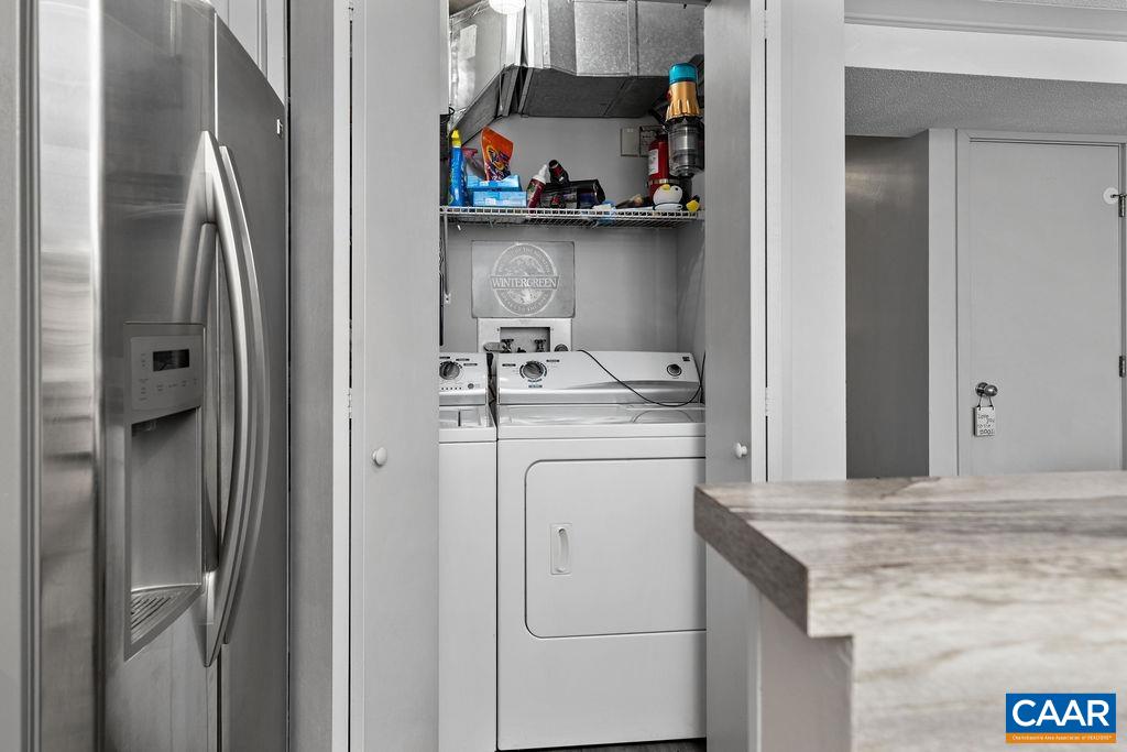 113 Eagles Court Roseland, VA 22967 - Photo 12 of 23 a kitchen with white cabinets and refrigerator
