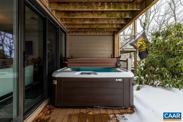 a room with a walk in closet and glass door