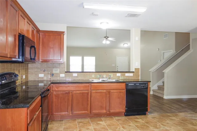 a kitchen with a sink and cabinets