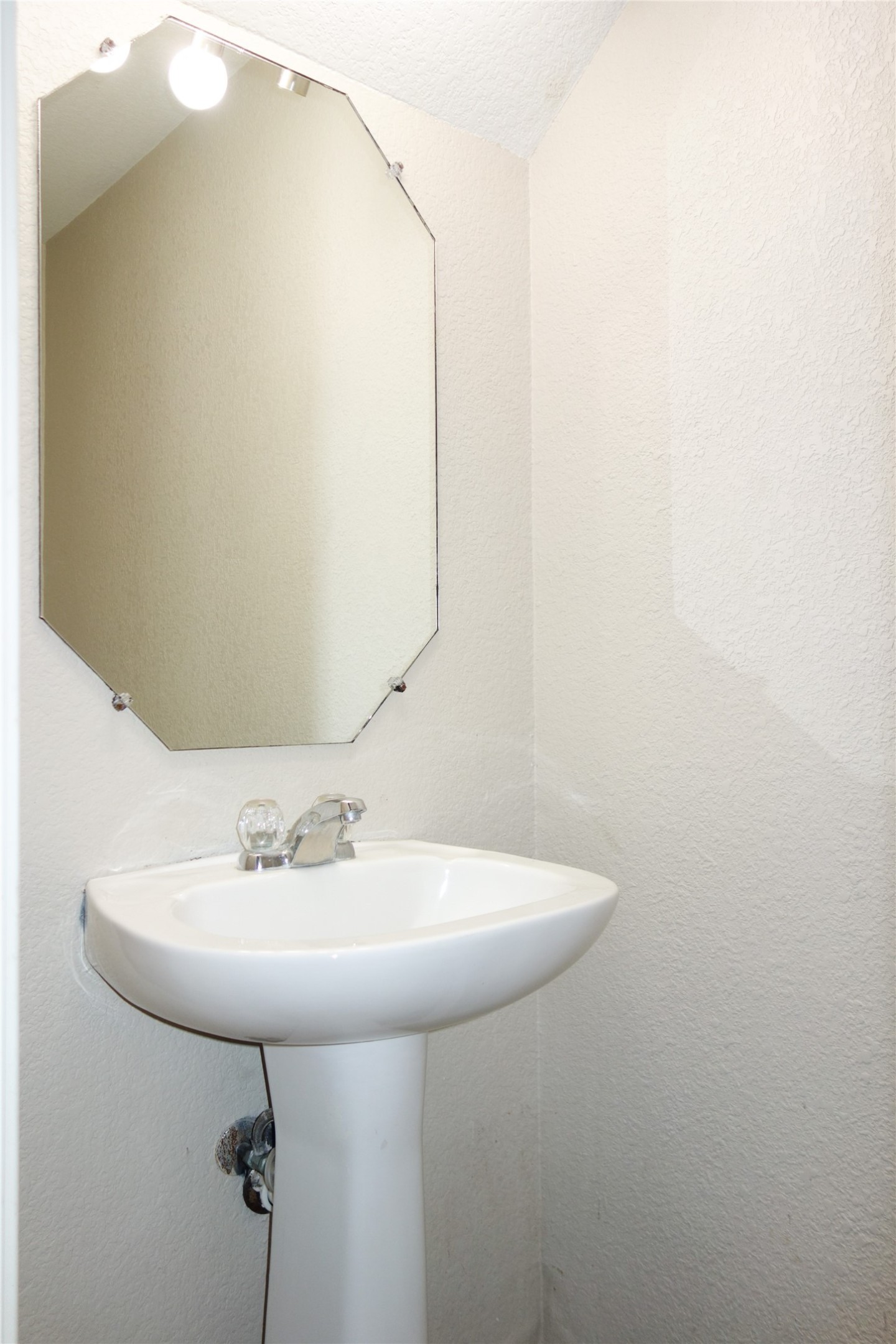 108 Lavaca Loop Hutto, TX 78634 - Photo 22 of 39 a bathroom with a sink and mirror