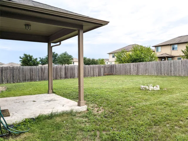 a view of a backyard with a garden and plants