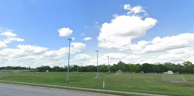 a view of a golf course with a lake