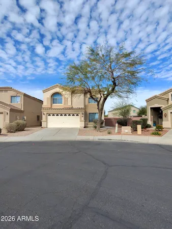 a view of kitchen with refrigerator and window
