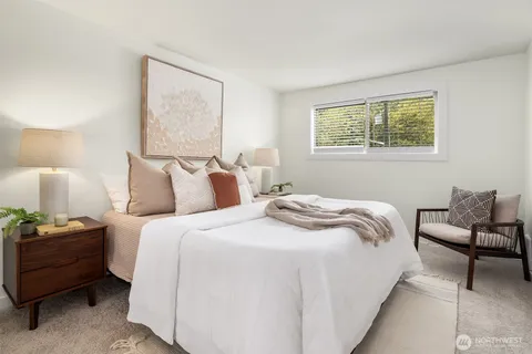 a bedroom with a bed and a couch