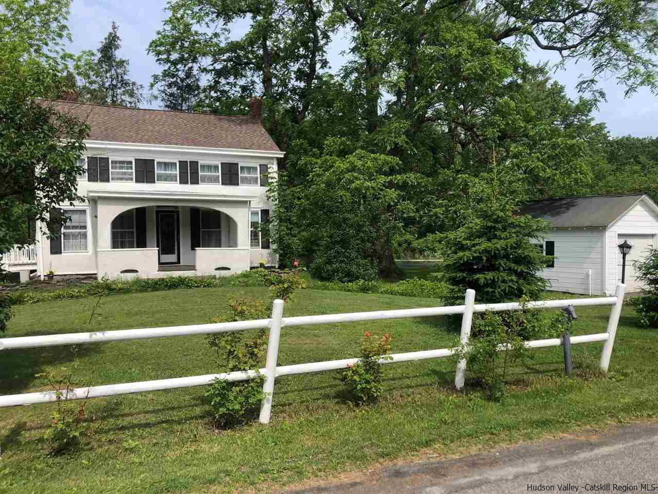 a view of house with a big yard