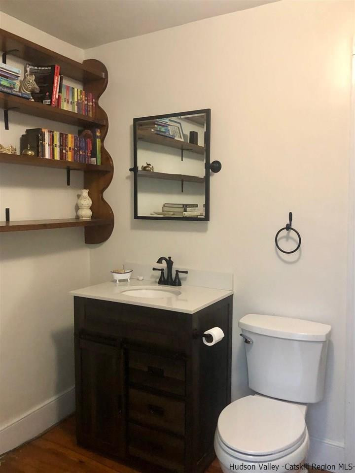 8 George Sickle Road, Unit 8 Saugerties, NY 12477 - Photo 14 of 24 a bathroom with a toilet a sink and a mirror