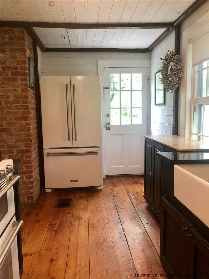 8 George Sickle Road, Unit 8 Saugerties, NY 12477 - Photo 15 of 24 a view of a kitchen with wooden floor and a kitchen