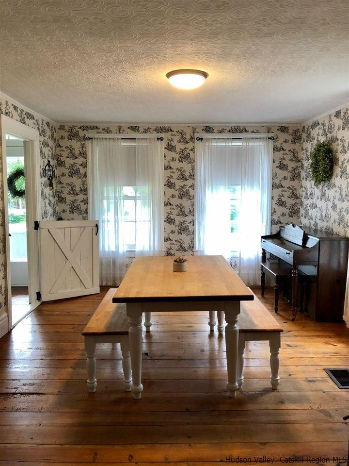 8 George Sickle Road, Unit 8 Saugerties, NY 12477 - Photo 21 of 24 a dining room with a table and chairs