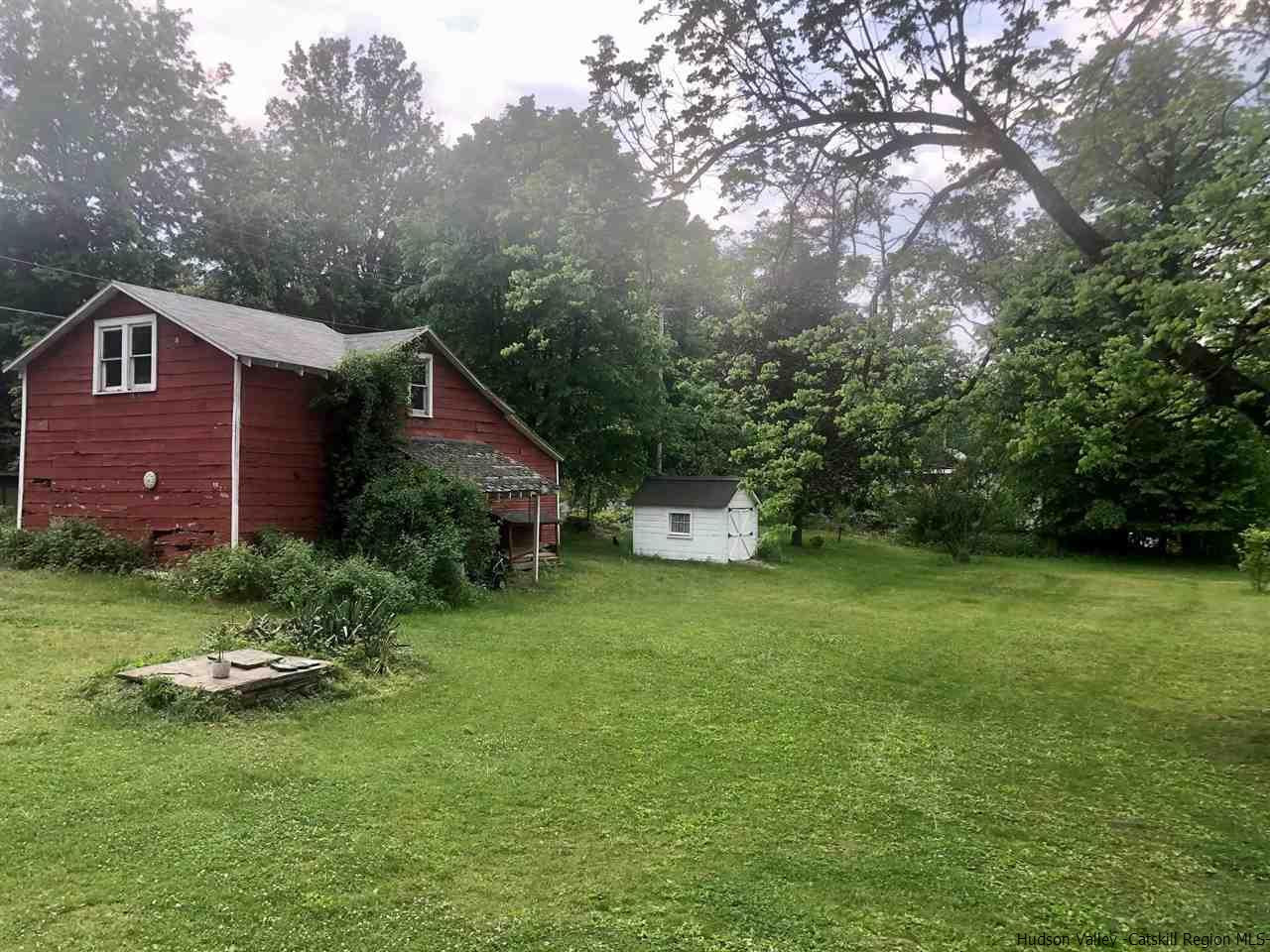 8 George Sickle Road, Unit 8 Saugerties, NY 12477 - Photo 6 of 24 a aerial view of a house with a yard table and chairs