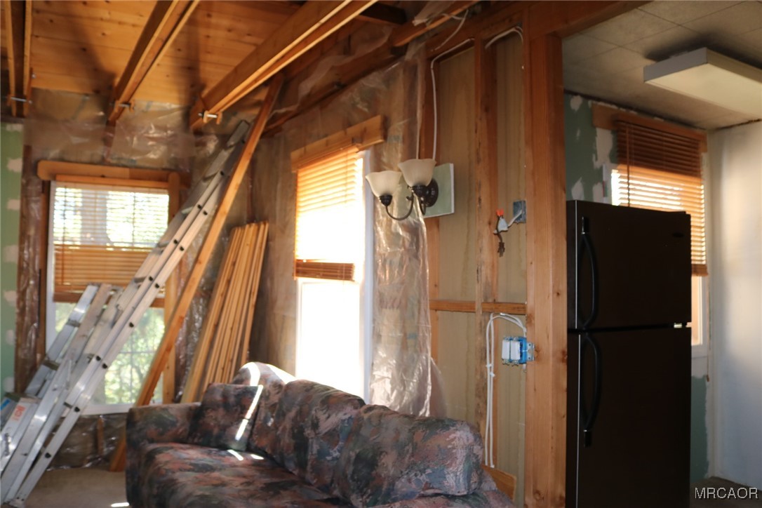 1247 Piney Ridge Place Fawnskin, CA 92333 - Photo 12 of 37 a living room with furniture and a window
