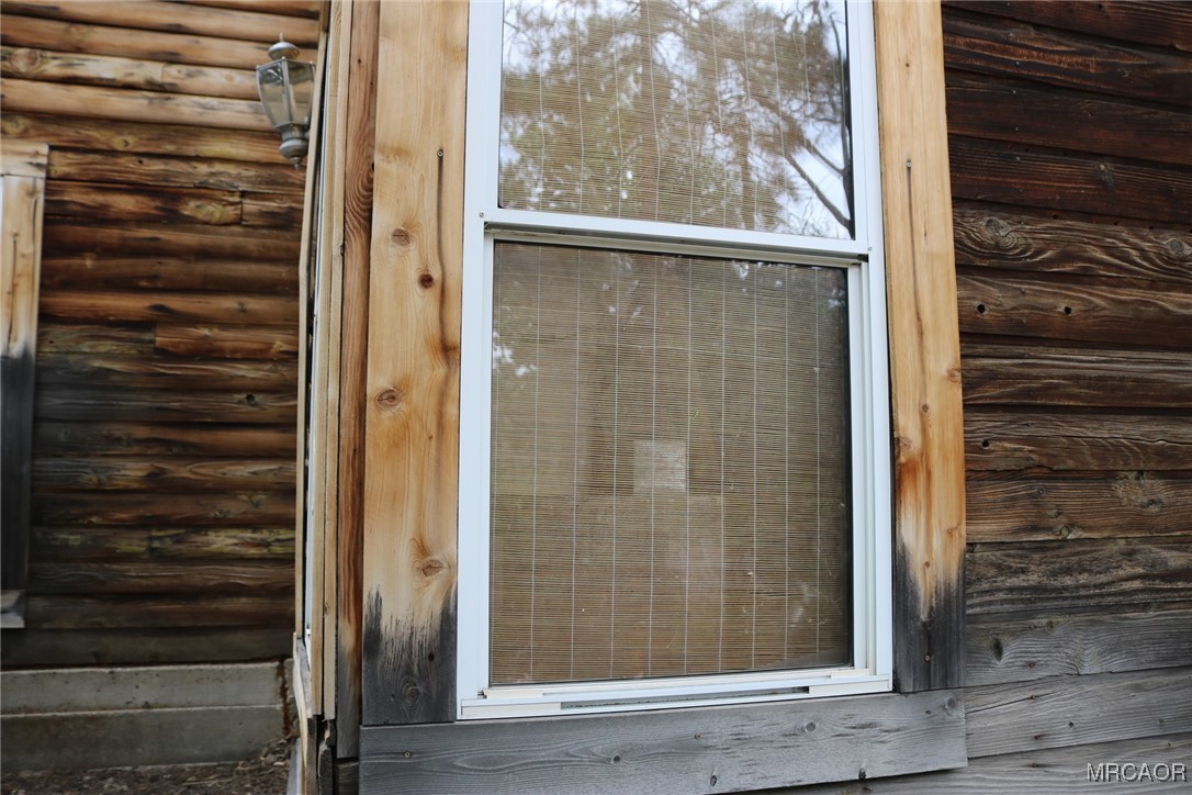 1247 Piney Ridge Place Fawnskin, CA 92333 - Photo 30 of 37 a view of a door front of a house
