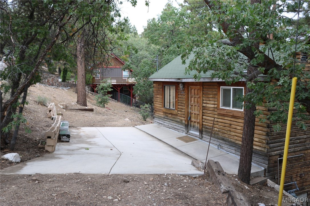 1247 Piney Ridge Place Fawnskin, CA 92333 - Photo 3 of 37 a house view with a backyard space