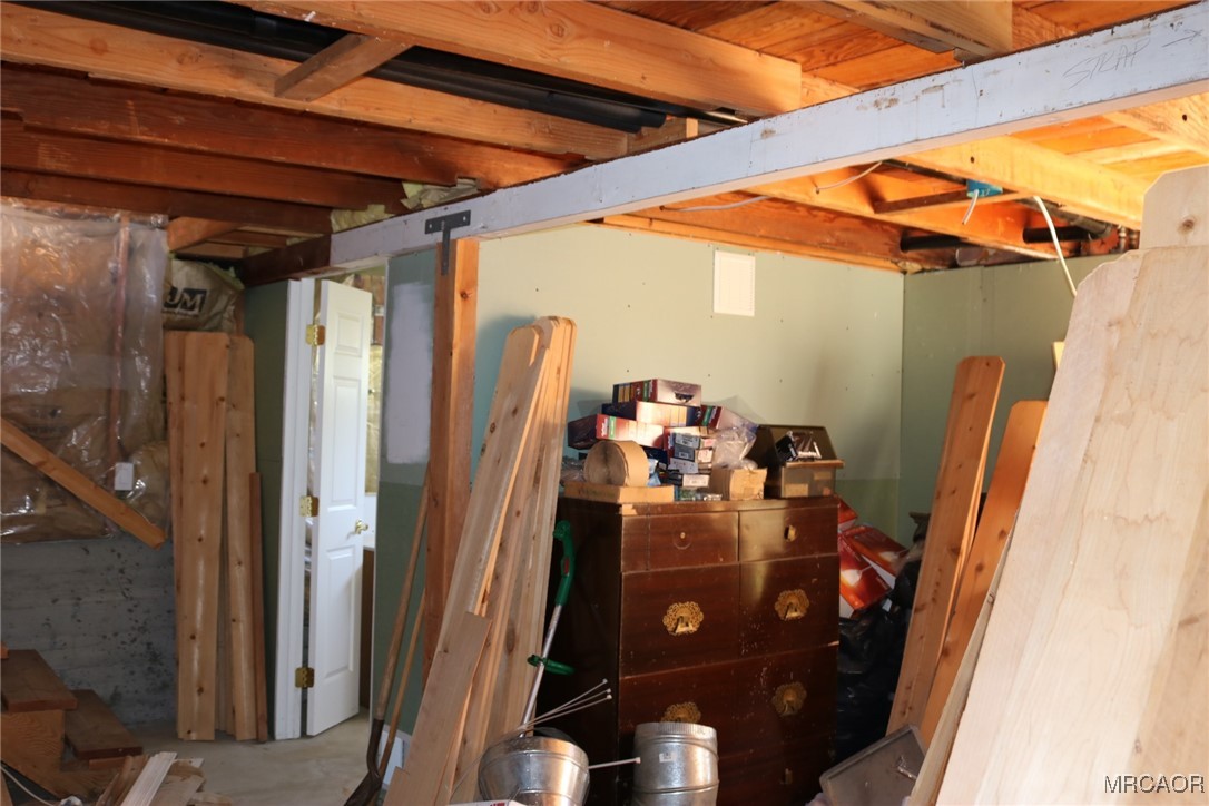 1247 Piney Ridge Place Fawnskin, CA 92333 - Photo 34 of 37 a view of a room with water heater and storage
