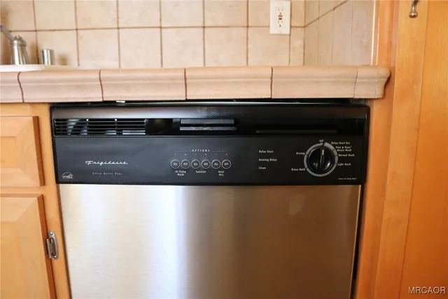 a black and white wall with a stove