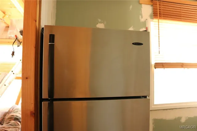 a bathroom with a shower and a mirror